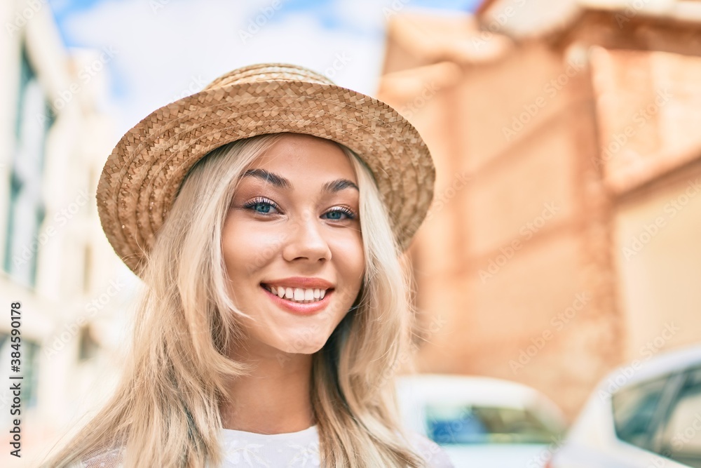 Young caucasian tourist girl smiling happy walking at street of city.