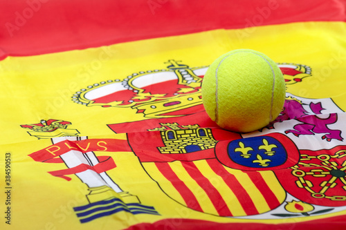 TENNIS OR PADEL BALL ON THE SPANISH FLAG. CARLOS ALCARAZ AND RAFAEL NADAL SUCCESS. photo