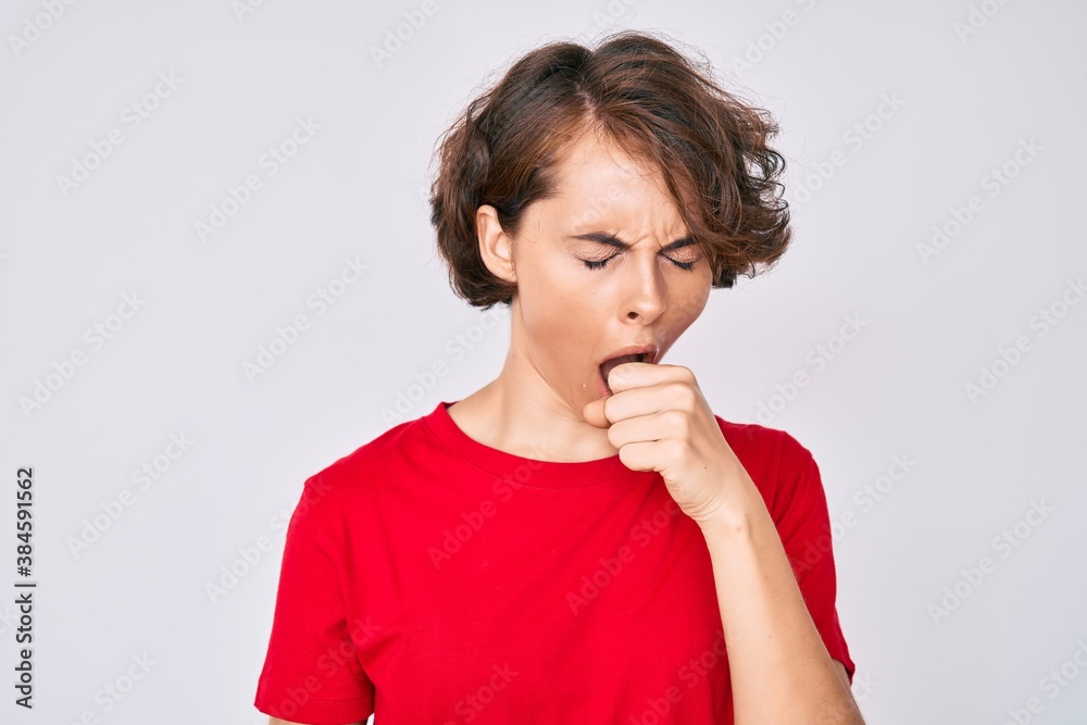 Young hispanic woman wearing casual clothes feeling unwell and coughing as symptom for cold or bronchitis. health care concept. Young hispanic woman wearing casual clothes feeling unwell and coughing as symptom for cold or bronchitis. health care concept.