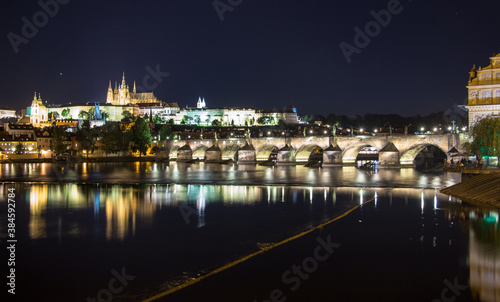 Pargue charles bridge and prague castle by night reflections river © Andreas