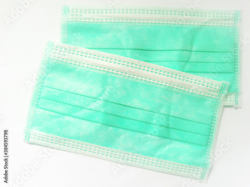 Green surgical face mask on white background, Health care concept and can protect virus covid-19, medical masks, fabric mask, protect air pollution