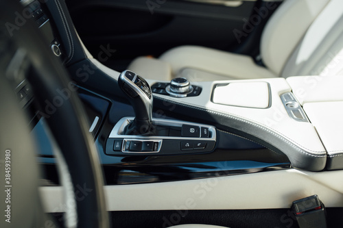 gear knob in a luxury car with beige leather
