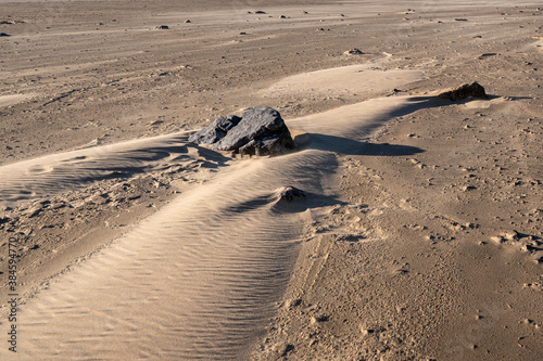 Shifting sands with movement of wind and water photo