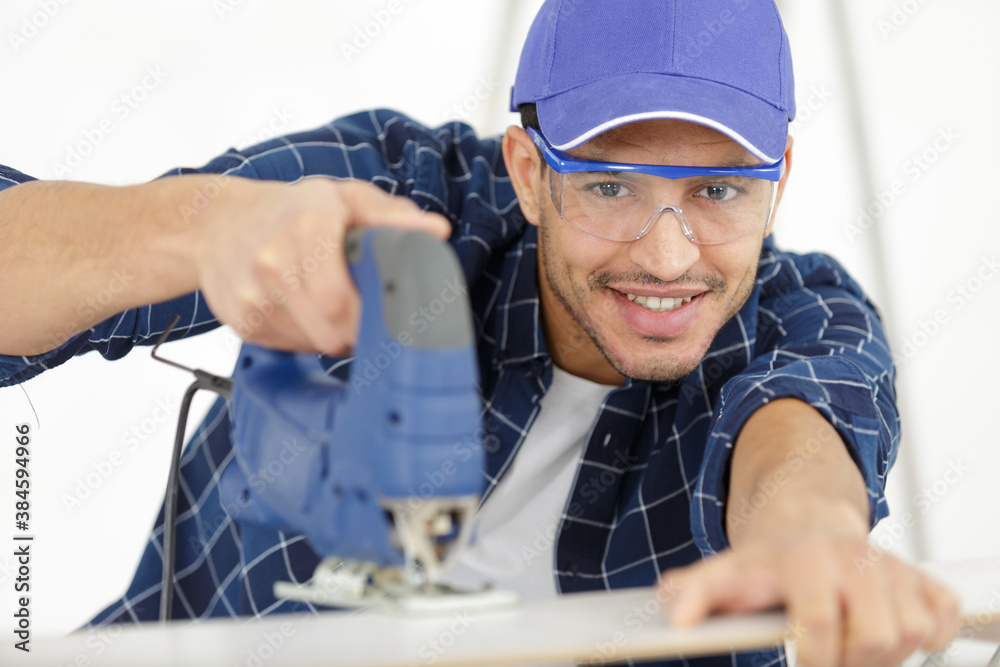carpenter work the wood with the sandpaper carpenter work the wood with the sandpaper