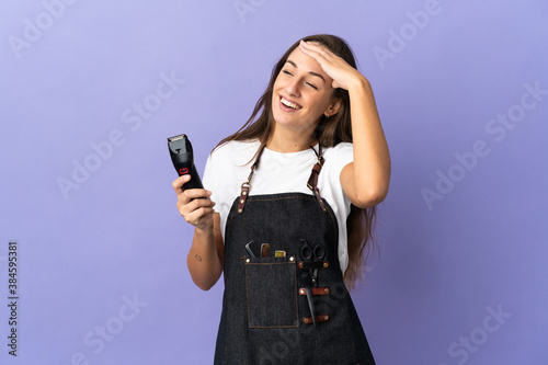 Young hairdresser woman over isolated background smiling a lot