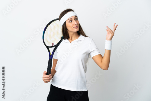 Young woman tennis player over isolated white background extending hands to the side for inviting to come