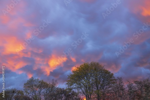 Gorgeous view of red cloudy sky during sunset. Beautiful nature backgrounds. © Alex