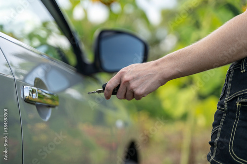 the girl opens the car with a key