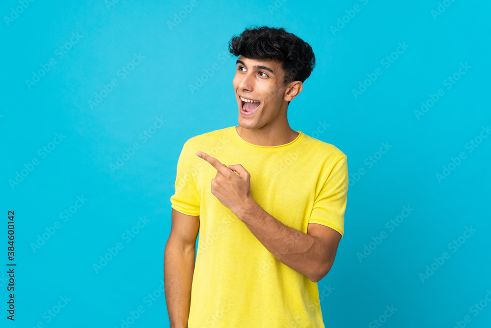 Young Argentinian man isolated on background intending to realizes the solution while lifting a finger up Young Argentinian man isolated on background intending to realizes the solution while lifting a finger up