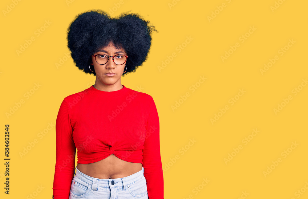 Young african american girl wearing casual clothes and glasses depressed and worry for distress, crying angry and afraid. sad expression. Young african american girl wearing casual clothes and glasses depressed and worry for distress, crying angry and afraid. sad expression.