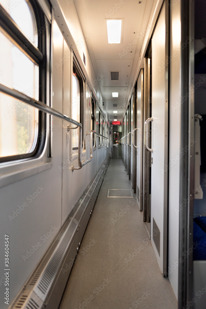 Corridor in the sleeping car of train. Rail travel. Vertical frame Corridor in the sleeping car of train. Rail travel. Vertical frame