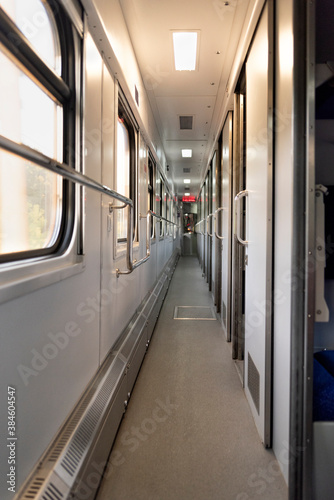 Corridor in the sleeping car of train. Rail travel. Vertical frame