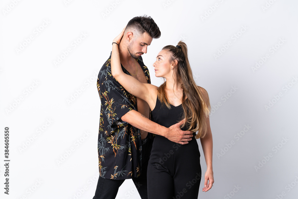 Couple dancing over isolated white background Couple dancing over isolated white background