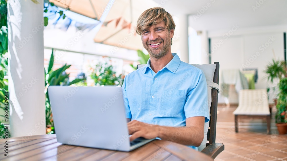 Middle age handsome man working at home using computer laptop Middle age handsome man working at home using computer laptop