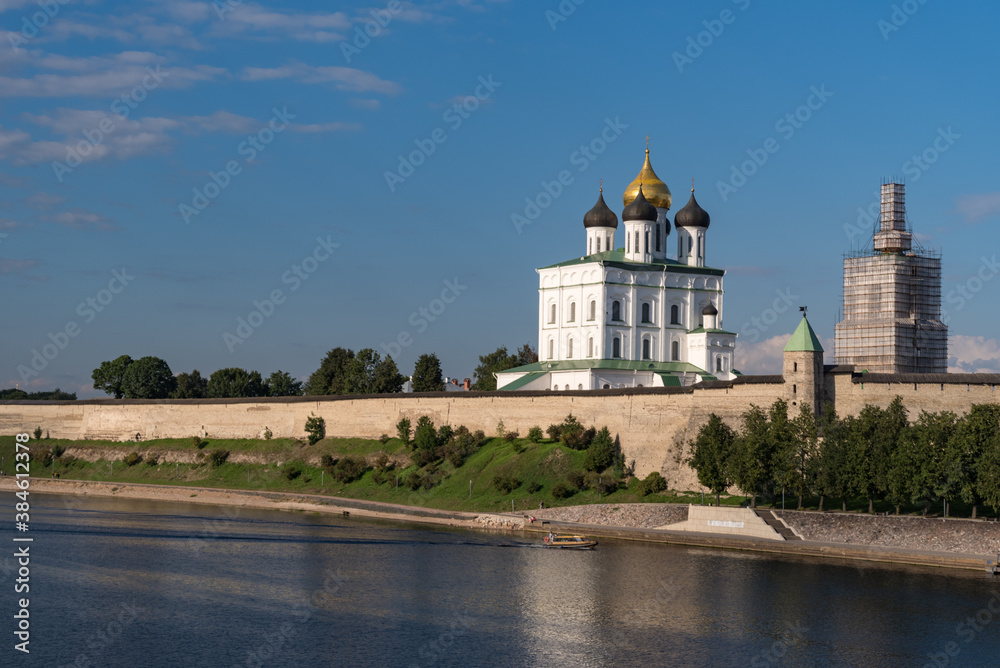 Pskov Kremlin view. Towers, wall and Trinity cathedral on background. Pskov, Russia