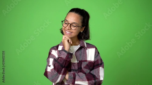 woman looking up on green screen chroma key background photo