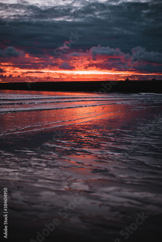 Beautiful red orange sunset at the beach sea