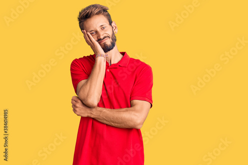 Handsome blond man with beard wearing casual clothes thinking looking tired and bored with depression problems with crossed arms.