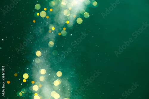 Festive Christmas of New Year green background with Christmas lights and snow