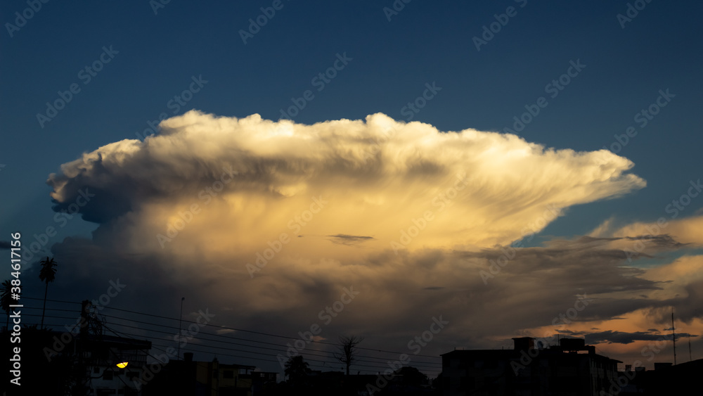 big cloud in the sky at sunset