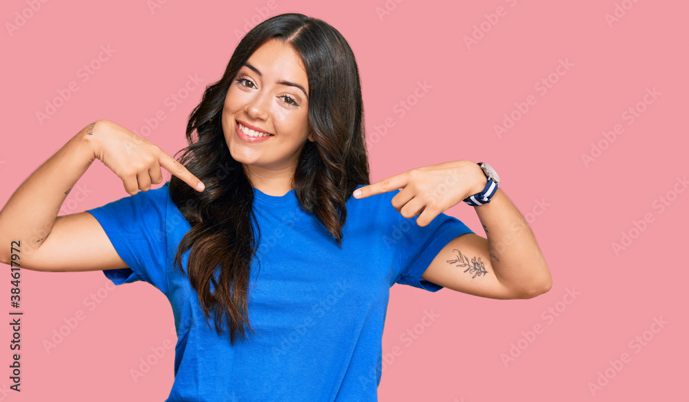 Beautiful brunette young woman wearing casual clothes looking confident with smile on face, pointing oneself with fingers proud and happy. Beautiful brunette young woman wearing casual clothes looking confident with smile on face, pointing oneself with fingers proud and happy.