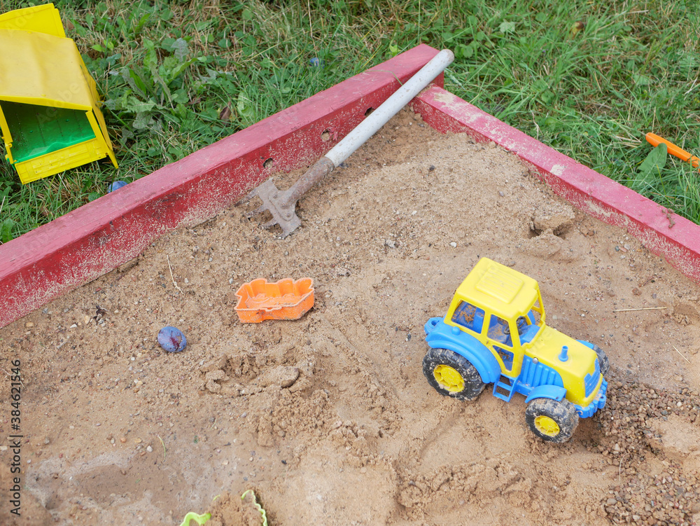 Children's toys in the sandbox.
