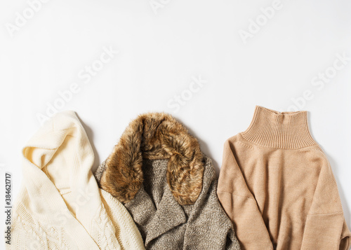 Set of warm cozy winter and autumn sweaters on white background