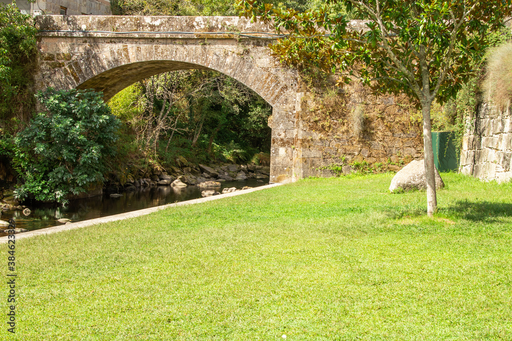 old bridge over the bubal river in os peares, ourense, galicia, spain