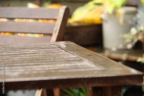 in the rain: wooden garden furniture