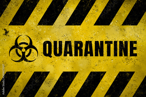 Grungy sign with biohazard icon and text „quarantine“ on it.