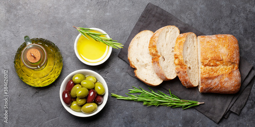 Ripe olives, olive oil and ciabatta bread