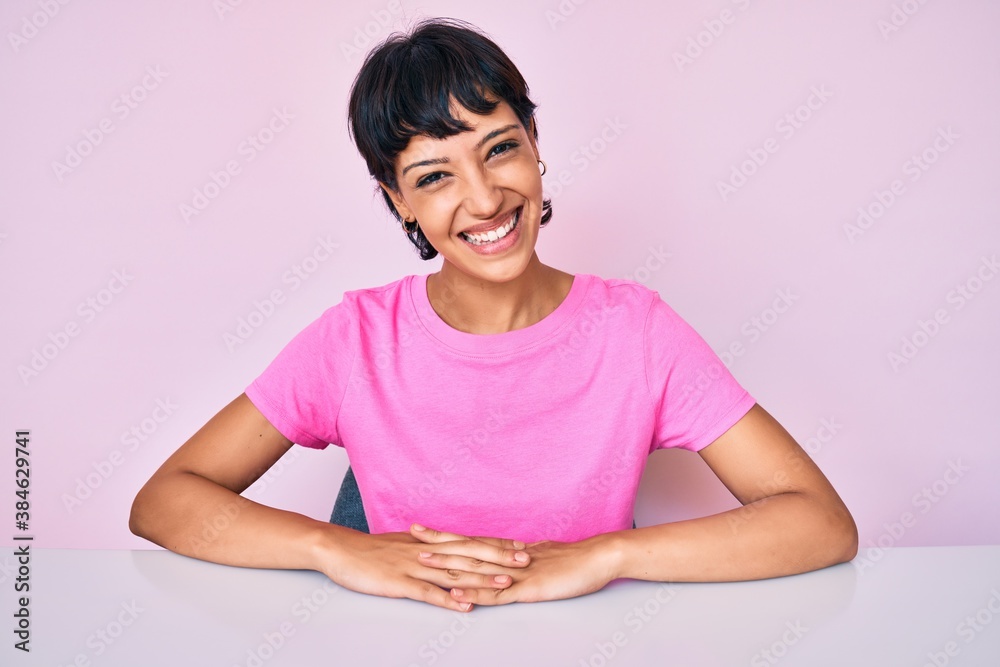 Beautiful brunettte woman wearing casual clothes over pink background looking positive and happy standing and smiling with a confident smile showing teeth Beautiful brunettte woman wearing casual clothes over pink background looking positive and happy standing and smiling with a confident smile showing teeth