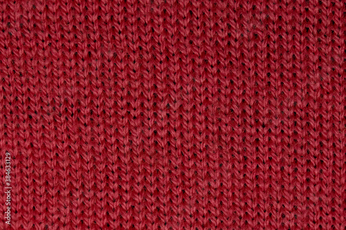 Red woolen background. Warm clothes.