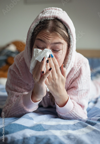 teenager girl with cold symptoms at home