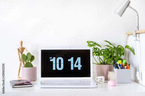Fotografie Girly home office / student room desk setup with white laptop and plants, mockup