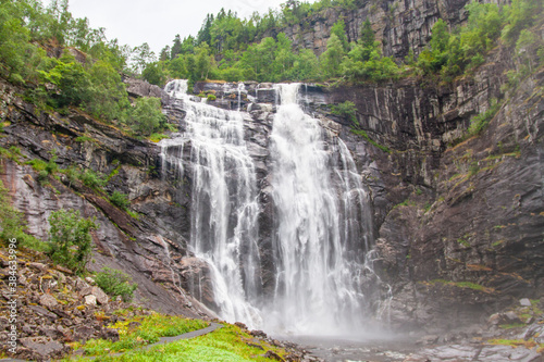 Skjervefoss waterfall in the forest  Norway  hidden secret waterfall