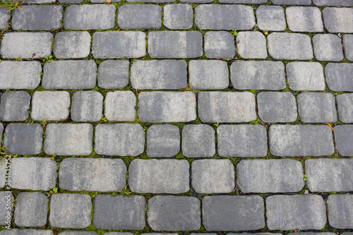 Texture of concrete pavement or sidewalk with paving slabs  top view. Blocks of the sidewalk pattern  details of the stone-tiled path