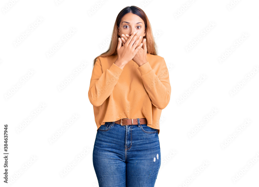 Beautiful young woman wearing casual clothes shocked covering mouth with hands for mistake. secret concept.