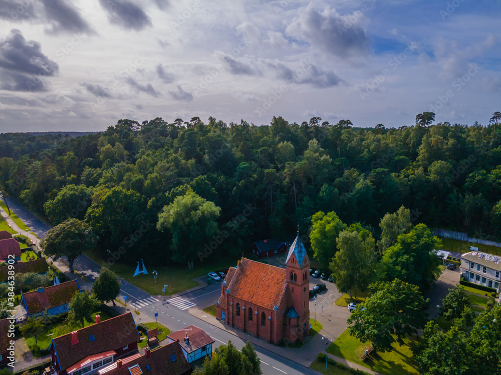 Aerial view of church in Juodkrante fisherman city in Curonian spit