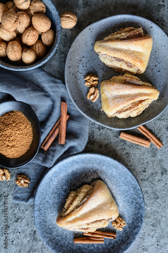 Rolled triangle pies with walnut and cinnamon