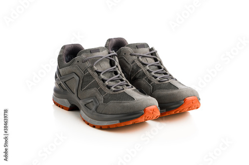 trekking sneakers with red sole, isolated on white