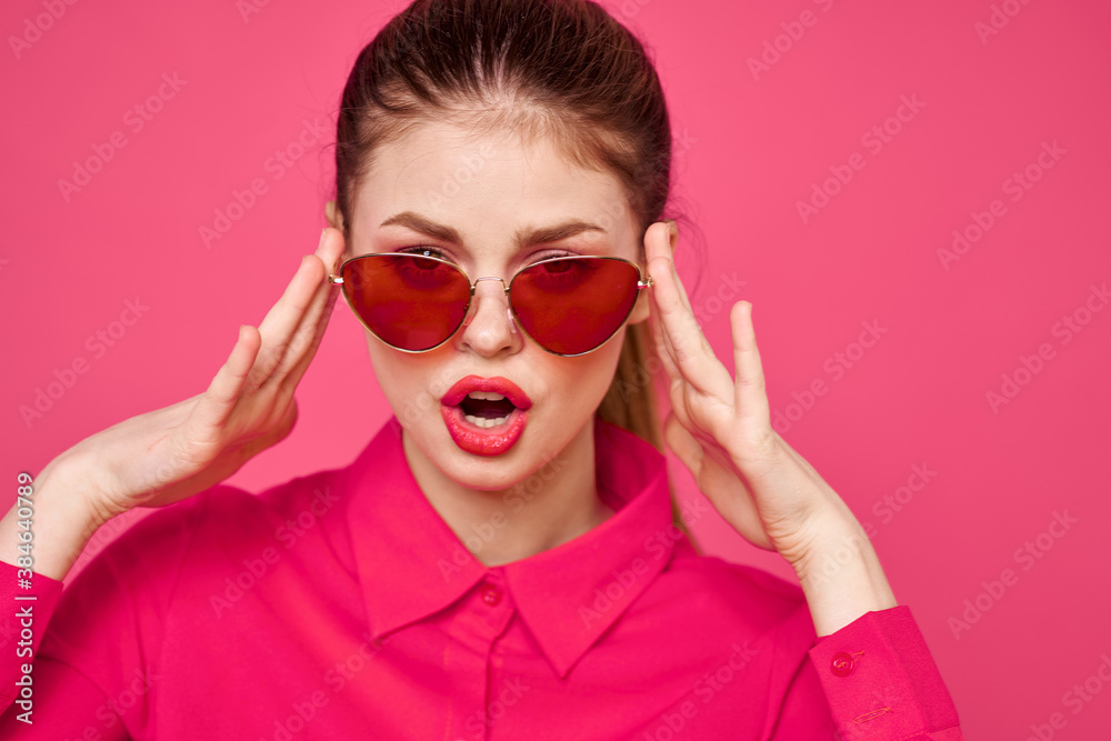 Woman in pink shirt and brown glasses cropped view fashion model emotions gesturing hands portrait Woman in pink shirt and brown glasses cropped view fashion model emotions gesturing hands portrait