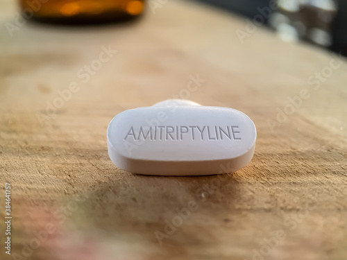 Amitriptyline Pill on wooden table
