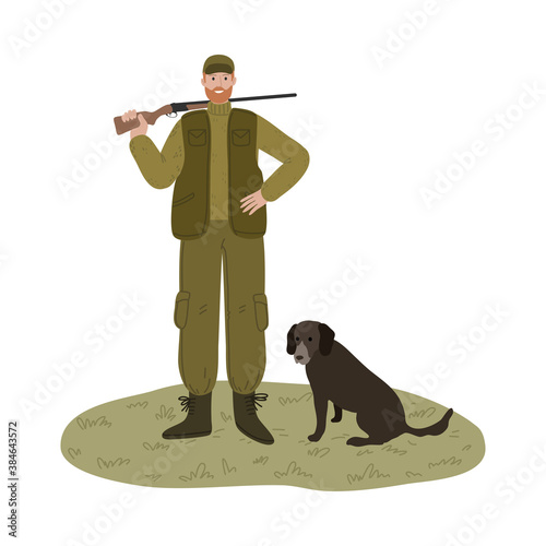 Man hunter in green traditional costume with gun standing with dog