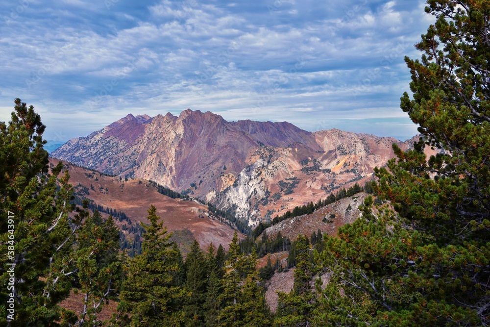 Sunset Peak hiking trail views towards Devil’s Castle Sugarloaf Mountain at Alta Resort on Great Western Trail in Rocky Wasatch Front Mountains, Midway and Heber, Utah. United States.