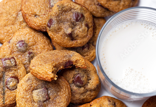 Close-up of homemade chocolate chip cookies and milk
