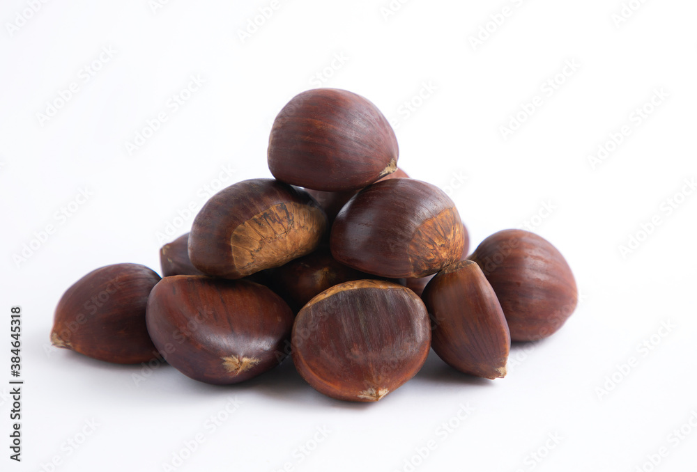 Fresh Chestnuts fruit isolated in wooden bowl on white background Fresh Chestnuts fruit isolated in wooden bowl on white background