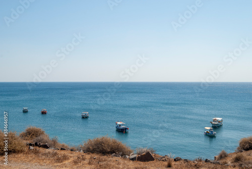 Boats fishing near the coast of Santorini island
