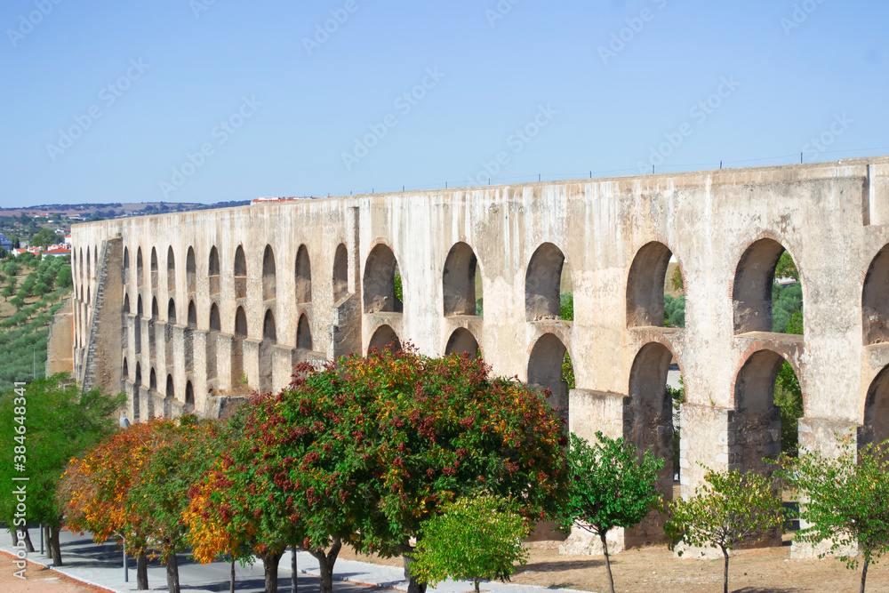 Autumn panoramic view with old aqueduct