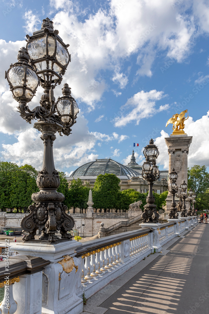Fototapeta premium Paris, France - May 23, 2020: Famous street lantern on the Alexandre III Bridge in Paris